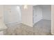Bright hallway leading to bedrooms and living areas with neutral carpet and freshly painted white walls at 7900 Holly Knoll Ave, Las Vegas, NV 89129