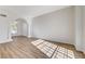 Bright, open living room featuring wood-look floors and natural light at 7900 Holly Knoll Ave, Las Vegas, NV 89129