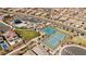 Aerial view of neighborhood with parks, tennis courts, and desert landscaping at 8106 Skye Glen St, Las Vegas, NV 89166