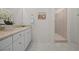 Well-lit bathroom featuring a vanity with light countertops, a large mirror, and a walk-in shower at 8106 Skye Glen St, Las Vegas, NV 89166