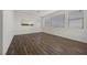 Spacious bonus room featuring wood floors and lots of natural light from the windows at 8106 Skye Glen St, Las Vegas, NV 89166