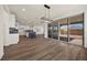 Bright open-concept dining area featuring modern lighting and access to the outdoors at 8106 Skye Glen St, Las Vegas, NV 89166