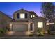 Charming two-story home featuring a brick driveway, manicured landscaping, and a neutral color scheme, perfect for curb appeal at 8106 Skye Glen St, Las Vegas, NV 89166