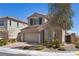 Beautiful two-story home boasts a brick driveway, complemented by well-maintained landscaping, enhancing its inviting appearance at 8106 Skye Glen St, Las Vegas, NV 89166