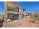 Two-story home featuring a covered patio, balcony, gravel landscaping, and a stucco exterior at 8106 Skye Glen St, Las Vegas, NV 89166