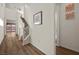 Inviting hallway with wood floors and a staircase leading to the upper level at 8106 Skye Glen St, Las Vegas, NV 89166