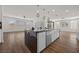 Spacious kitchen featuring an island with white cabinetry and a breakfast bar under modern pendant lights at 8106 Skye Glen St, Las Vegas, NV 89166