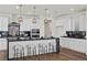Stylish kitchen features a large island with bar seating and pendant lighting at 8106 Skye Glen St, Las Vegas, NV 89166