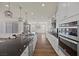 Spacious kitchen with stainless steel appliances and large island with pendant lighting at 8106 Skye Glen St, Las Vegas, NV 89166