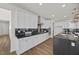 Modern kitchen with white cabinets, black countertops, and stainless steel appliances at 8106 Skye Glen St, Las Vegas, NV 89166