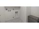 Clean laundry room offering tile floor and basket for storage at 8106 Skye Glen St, Las Vegas, NV 89166