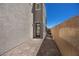 A private side patio with brick pavers, a doorway, and a tall brick wall at 8106 Skye Glen St, Las Vegas, NV 89166