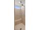 Modern shower with neutral-toned tiling, a built-in bench, and multiple shower heads at 8106 Skye Glen St, Las Vegas, NV 89166