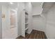 Walk-in closet features an open layout with built-in shelves and access to the bathroom at 8106 Skye Glen St, Las Vegas, NV 89166