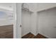 Organized walk-in closet with hanging rods, shelves, and wood flooring at 8106 Skye Glen St, Las Vegas, NV 89166