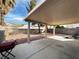 Spacious backyard featuring a covered patio, perfect for relaxing and outdoor activities at 8166 Tone St, Las Vegas, NV 89123
