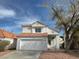 Charming two-story home with a well-maintained front yard and a two-car garage at 8166 Tone St, Las Vegas, NV 89123