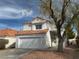 Charming two-story home with a well-maintained front yard and a two-car garage at 8166 Tone St, Las Vegas, NV 89123