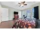 Bright bedroom featuring hardwood floors, shutters, and contemporary design at 8390 Carmel Ridge Ct, Las Vegas, NV 89113