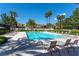 Community pool and lounge area with chairs and ample space for community members at 8390 Carmel Ridge Ct, Las Vegas, NV 89113