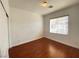 Bedroom featuring hardwood floors, white walls, and natural light from a window at 8576 Peaceful Dreams St, Las Vegas, NV 89139