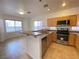 Bright kitchen featuring granite countertops, stainless steel appliances, and ample cabinet space at 8576 Peaceful Dreams St, Las Vegas, NV 89139