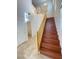 Staircase featuring wood treads, a modern chandelier, and tile flooring at 8576 Peaceful Dreams St, Las Vegas, NV 89139