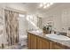 Bathroom features double sinks, vanity, and shower at 9020 Loggers Mill Ave, Las Vegas, NV 89143