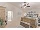 Cozy bedroom features a ceiling fan and coordinating accent pillows and throws at 9020 Loggers Mill Ave, Las Vegas, NV 89143