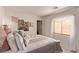 Inviting bedroom with a decorative bed and soft, natural lighting at 9020 Loggers Mill Ave, Las Vegas, NV 89143