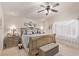 Bedroom with a ceiling fan, decorative pillows, and a window with sheer curtains at 9020 Loggers Mill Ave, Las Vegas, NV 89143