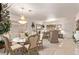 Bright dining room featuring a chandelier over a glass table and seating at 9020 Loggers Mill Ave, Las Vegas, NV 89143