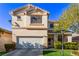 Charming two-story home with a well-manicured lawn and inviting front entrance at 9020 Loggers Mill Ave, Las Vegas, NV 89143