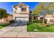 Charming two-story home with a well-manicured lawn and inviting front entrance at 9020 Loggers Mill Ave, Las Vegas, NV 89143