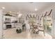 Bright, functional kitchen with granite countertops, stainless steel appliances, and breakfast table at 9020 Loggers Mill Ave, Las Vegas, NV 89143