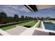 Spacious backyard with bocce court, pool, and covered patio at 9930 Zakos Ct, Las Vegas, NV 89149