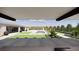 Expansive backyard featuring a pool, lush greenery, and an outdoor entertaining space at 9930 Zakos Ct, Las Vegas, NV 89149