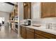 Bright kitchen with quartz countertops, stainless steel appliances, and custom cabinets for a sleek modern look at 9930 Zakos Ct, Las Vegas, NV 89149