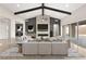 Modern living room with a fireplace, contemporary decor, and access to the backyard at 9930 Zakos Ct, Las Vegas, NV 89149
