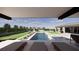 Luxurious pool and spa area with lounge chairs and a covered pergola, perfect for relaxation at 9930 Zakos Ct, Las Vegas, NV 89149