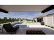 Stunning backyard with pool, lounge chairs, and a modern fire pit area for outdoor enjoyment at 9930 Zakos Ct, Las Vegas, NV 89149