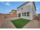 Fenced backyard features artificial turf at 9983 Cluny Ave, Las Vegas, NV 89178