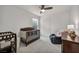 Bedroom features dark wood crib, changing table, glider chair, and neutral decor at 9983 Cluny Ave, Las Vegas, NV 89178