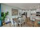 Bright dining area featuring a wooden table and stylish decor at 9983 Cluny Ave, Las Vegas, NV 89178