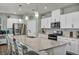 Modern kitchen with a large island, stainless steel appliances, and stylish pendant lights at 9983 Cluny Ave, Las Vegas, NV 89178