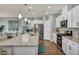 Bright kitchen with white cabinets, stainless steel appliances, and granite countertops at 9983 Cluny Ave, Las Vegas, NV 89178
