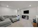 A well lit open living room offers a spacious layout with comfortable seating and entertainment options at 9983 Cluny Ave, Las Vegas, NV 89178