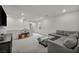 Cozy living room with a comfortable gray sectional sofa, adjacent to a fun play area at 9983 Cluny Ave, Las Vegas, NV 89178