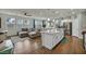 Spacious living room with a large sectional sofa and a modern ceiling fan at 9983 Cluny Ave, Las Vegas, NV 89178