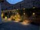 Serene backyard illuminated at night with decorative lights, creating a magical outdoor space at 101 Mirage View Dr, Henderson, NV 89011